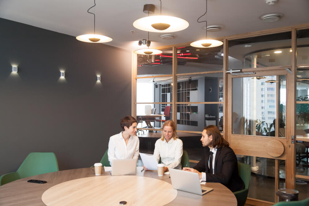 businesspeople-having-discussion-team-meeting-modern-office-interior